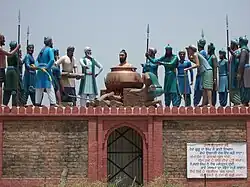 Sculpture of the execution of Bhai Dayala by being boiled alive at Mehdiana Sahib