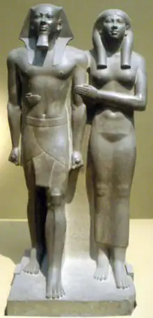 Image 18Greywacke statue of the pharaoh Menkaure and his queen consort, Khamerernebty II. Originally from his Giza temple, now on display at the Museum of Fine Arts, Boston. (from History of ancient Egypt)