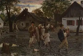 Four men walking through a village in an intoxicated state