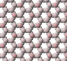 View of tetrahedral sheet of muscovite. The apical oxygen ions are tinted pink.