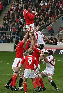 Welsh player Michael Owen takes a lineout