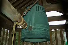 This bell is called Mii-dera no Bansho (三井寺の晩鐘), the evening bell at Mii-dera, a Buddhist temple in Otsu, which is near Lake Biwa in Shiga Prefecture, Japan. This image shows the hanging wooden beam positioned to strike the outer side of the resonating surface.