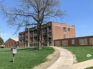 The original Miles School building prior to its partial demolition in 2019, making way for a new one-story Easton Valley Elementary School.