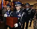 Major Robert Bonner carries the remains of Lt. Gen. A.P. Clark, who was taken as a prisoner of war during World War II.