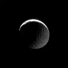 The transition from light to dark takes place on two fronts in this image of Mimas.