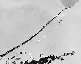 Image 16Miners and prospectors climb the Chilkoot Trail during the Klondike Gold Rush. (from History of Alaska)