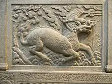 Image 5Gilin with the head and scaly body of a dragon, tail of a lion and cloven hoofs like a deer. Its body enveloped in sacred flames. Detail from Entrance of General Zu Dashou Tomb (Ming Tomb). (from Chinese culture)