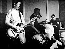 Baker (center) performing with Minor Threat live at the Wilson Center in Washington, D.C. in 1981