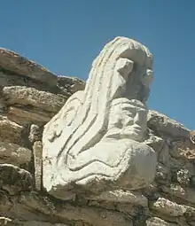 Image 31Ballcourt marker from the Postclassic site of Mixco Viejo in Guatemala. This sculpture depicts Kukulkan, jaws agape, with the head of a human warrior emerging from his maw. (from Snake)