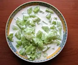 Mizeria (Polish traditional salad made from sliced cucumbers in sour cream with dill)