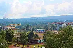 A photo of Moa with the manynickel factories in the background