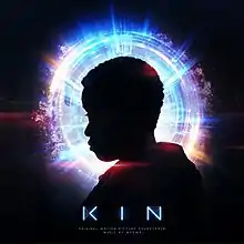 The silhouette of a person in front of a blue and purple halo.  The title of the album appears below the figure.