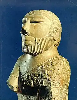 Statue of "Priest King" wearing a robe; 2400–1900 BCE; low fired steatite; National Museum of Pakistan (Karachi)