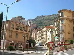 Lamarck Square, Les Moneghetti; this square contains, a garden, a post office, and a police station; the parish church (Sacred Heart) is 46 metres (50 yd) away.