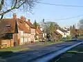 The village seen from the main road (A4010) in 2009.