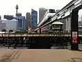 Monorail travelling over Pyrmont Bridge while the bridge is open.