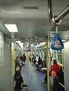 Interior of a passenger car of Ma On Shan line SP1950 train, built by Kinki Sharyo