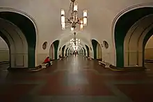 Wide, round-ceilinged hallway of VDNKh Metro station