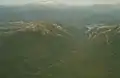 Mount Huxley from the air, at left, King River Gorge centre, Mount Jukes Highway to right, and Lake Burbury and the Crotty Dam at rear.