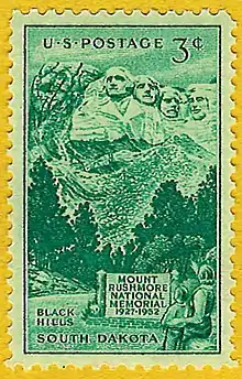 Green 3-cent postage stamp showing people looking at Mount Rushmore