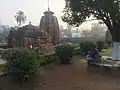 Artist playing flute in Mukteswar temple