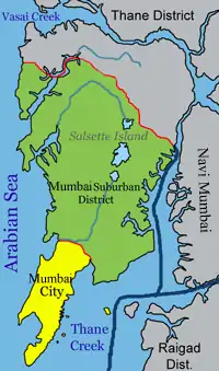  Mumbai is on a narrow peninsula on the southwest of Salsette Island, which lies between the Arabian Sea to the west, Thane Creek to the east, and Vasai Creek to the north. Mumbai's suburban district occupies most of the island. Navi Mumbai is east of Thane Creek, and the Thane District is north of Vasai Creek.