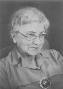 black and white portrait photograph of Muriel Robertson wearing spectacles