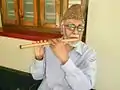 With his favorite instrument - the flute