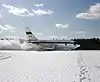 NASA 515 during braking test run on snow-covered runway at Brunswick Naval Air Station.