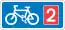 Rectangular, blue traffic sign with a white bicycle symbol and a red square with the number 2 in it.