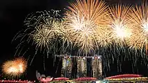 Image 29Fireworks over the Marina Bay skyline following the conclusion of the 2015 National Day Parade on 9 August 2015. (from History of Singapore)