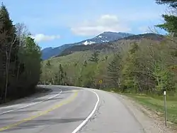 New Hampshire Route 16 in Martin's Location, May 2019. Mount Washington rises to the south, outside the township.