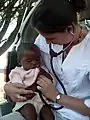 Doctor examining a patient at Naankuse Lifeline Clinic