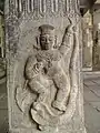 Krishna dancing over snake Kaliya at the sand-covered temple ruins in Talakkadu, Karnataka, India.