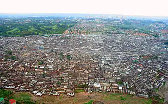 Many shacks clustered together and photographed from the air