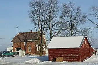 Brick house and log shed