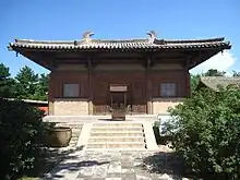 One of the oldest existing structure exhibiting a Xieshan roof — The Great Buddha Hall in Nanchan Temple on Mount Wutai, Wutai County, Shanxi, China, dating back to the Tang dynasty (618-907).