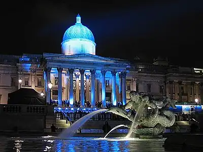 Image 11National GalleryPhoto credit: Michael ReeveThe National Gallery at night, illuminated for an event to promote the launch of a Pepsi commercial.The National Gallery in London is an art gallery designed by William Wilkins. It holds part of the National Collection, particularly Western European art from 1250 to 1900. The collection of 2300 paintings belongs to the British public.More featured pictures