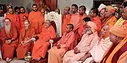 Bodhinatha attends a conference of Natha Sampradaya swamis hosted by Balagangadharanatha Swamiji. Includes Yogi Adityanath on center right.