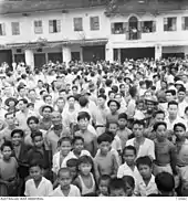 Large crowd of Sarawak native population throngs the street of Kuching to witness the arrival of Australian Imperial Force (AIF) on 12 September 1945.