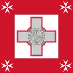 The Naval Jack of Malta intended to be flown by Maltese military vessels consists of a square flag, consisting of a George Cross proper fimbriated in red in the centre of a white square, within a red square. Each corner of the red square shall contain a white Maltese Cross.