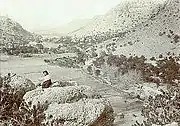 Neil Erickson relaxing on top of a rock formation in Bonita Canyon