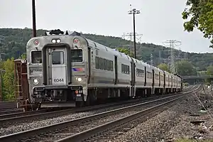  New Jersey Transit Comet V cab car #6044 leading Hoboken bound train #66, nearing Suffern.