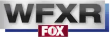 In a silver box with a blue drop shadow, the black letters WFXR in a sans serif. Mounted below and slightly overlapping is a red box with the Fox network logo in white.