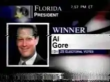 A television screen displaying presidential candidate Al Gore and text reading "WINNER"