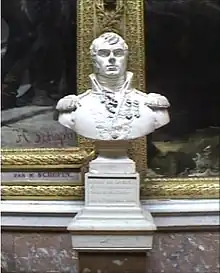 Bust of man with a dimple on his chin. He wears an early 1800s military uniform with a high collar.