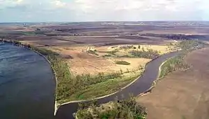 View of the confluence of two rivers in an agricultural area