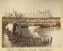 old boat in aqueduct over creek