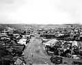 Nogales International Boundary looking west, in 1899 (prior to boundary fence and border inspection facilities)