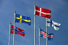 The flags of Denmark, Iceland, Finland, Sweden, and Norway flying on flagpoles